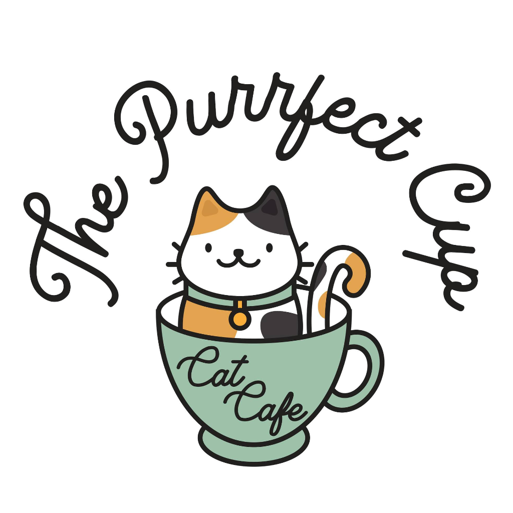 A cute cartoon cat with brown and black spots on white, sitting in a mug. Overhead are the words 'The Purrfect Cup' and the mug has the words 'Cat Cafe'.